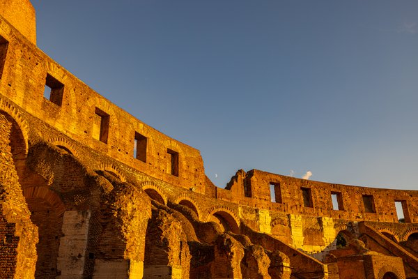 Golden light on Colosseum walls
