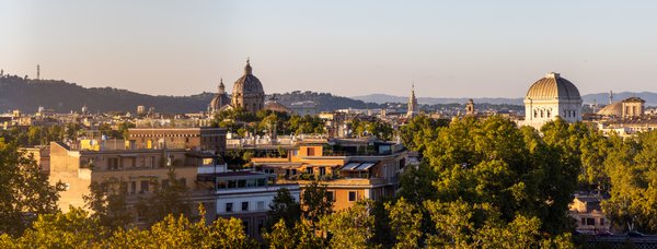 Rome skyline with domes at golden hour