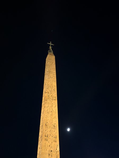 Moonlit Egyptian obelisk at night