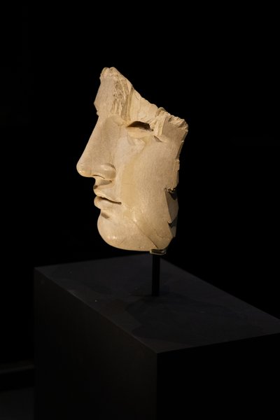 Fragmented marble face on plinth