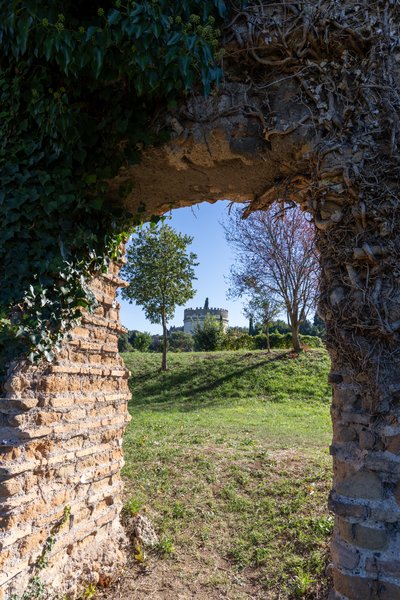 Cecilia Metella tower framed by an arch